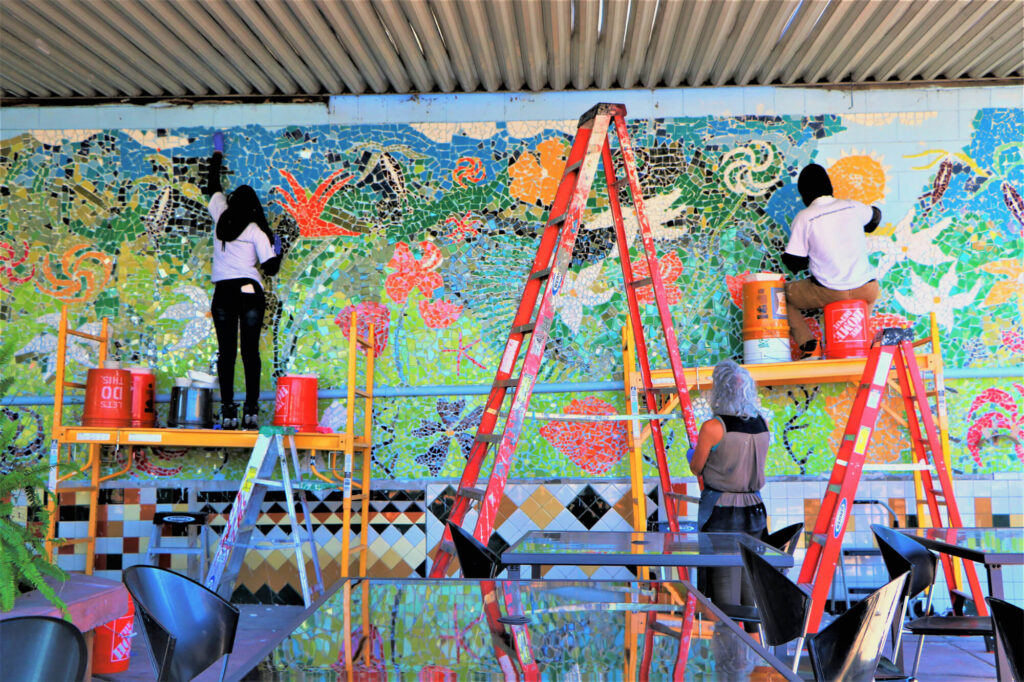 Kids building mosaic mural