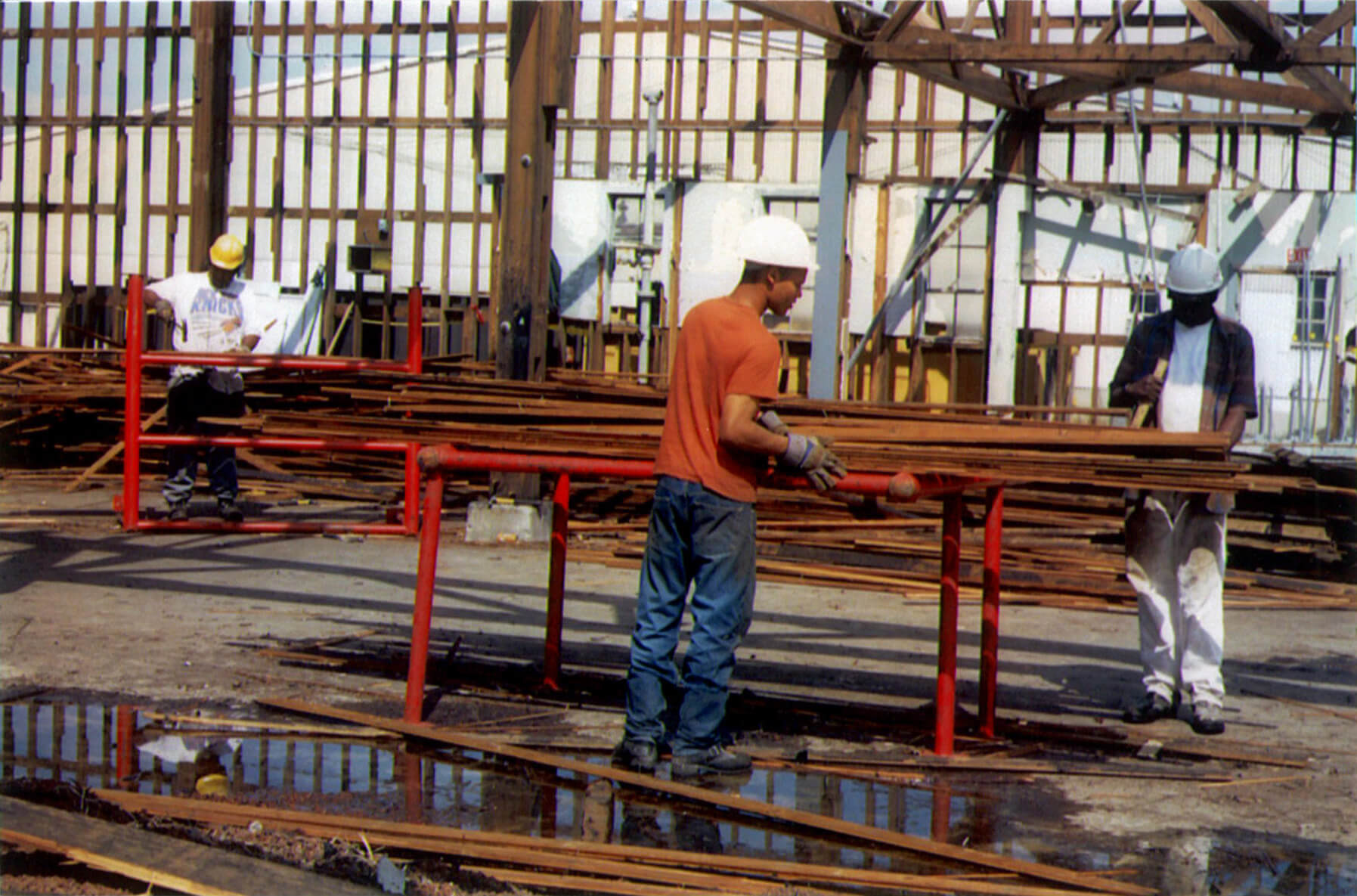 Person outdoors with lumber